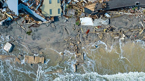 Remnants of Nicole exiting Eastern Seaboard after historic late-season hurricane strike