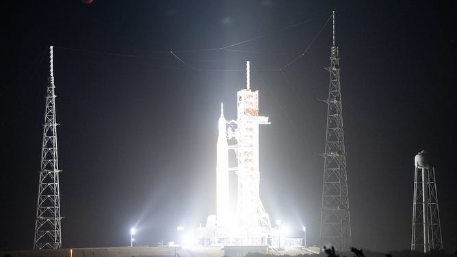 The Moon is seen during a total lunar eclipse above NASA’s Space Launch System (SLS) rocket with the Orion spacecraft aboard atop a mobile launcher at Launch Pad 39B, Tuesday, Nov. 8, 2022, at NASA’s Kennedy Space Center in Florida. NASA’s Artemis I flight test is the first integrated test of the agency’s deep space exploration systems: the Orion spacecraft, SLS rocket, and supporting ground systems.