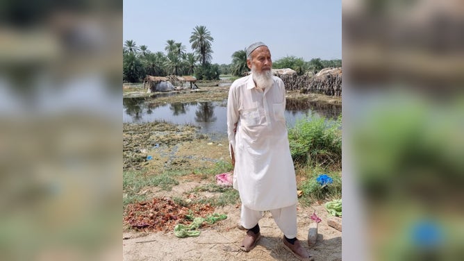 Qadri's father at his farm in Sukkur, Pakistan, after the floods began to subside.