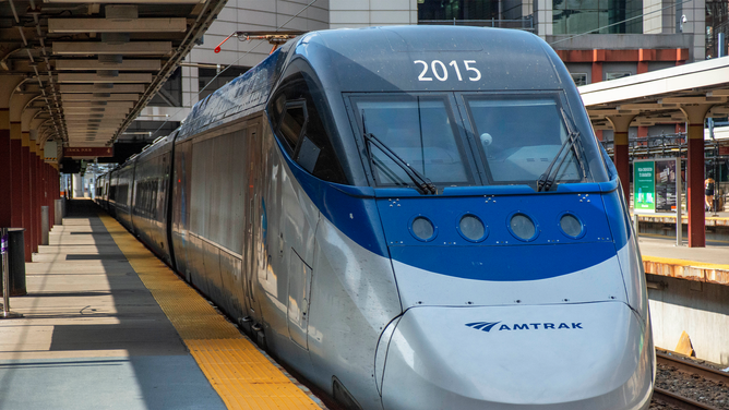 FILE - A close-up of AMTRAK Acela Express electric power car at Boston South Station. Amtrak Acela Express is a high speed tilting train.