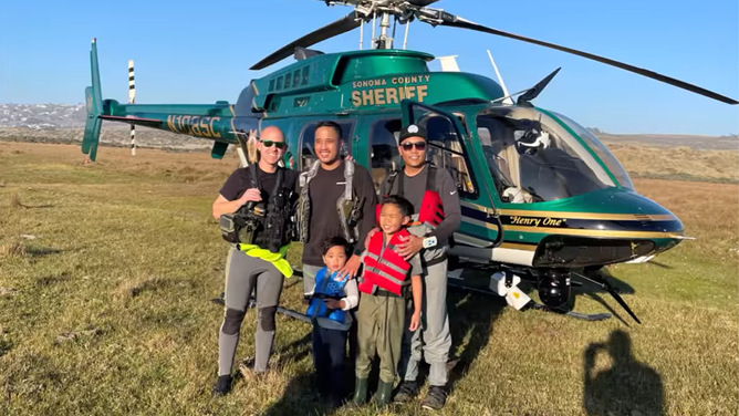A photo shows kayakers, including two children, who were rescued after being swept out to sea in Marin County, California, on Saturday, November 26, 2022.