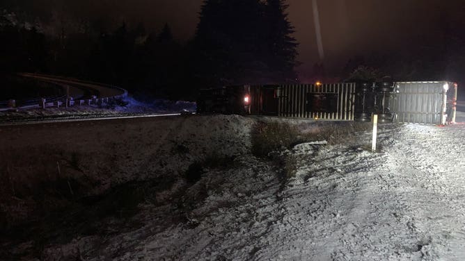 A semi-truck on its side in the snow on Southbound I-5 in Whatcom County, Washington on Nov. 30, 2022