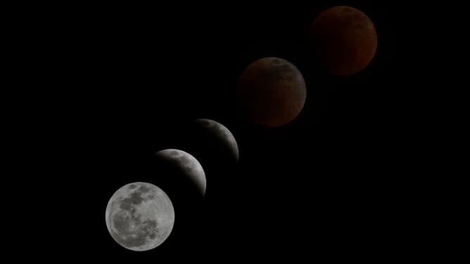 Multiple exposures were combined to produce this image) The moon is in eclipse on Sunday night from Bogota, Colombia on May 15, 2022. 