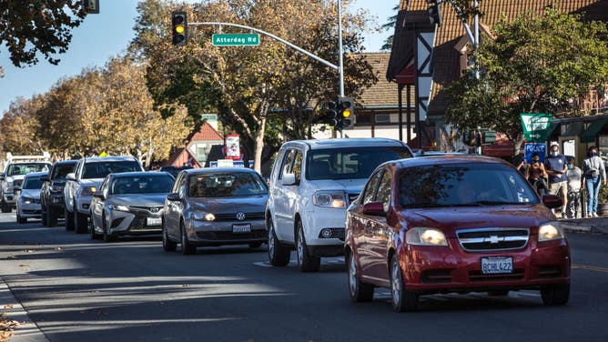Traffic backs up along Highway 246 through downtown on November 28, 2020, in Solvang, California.