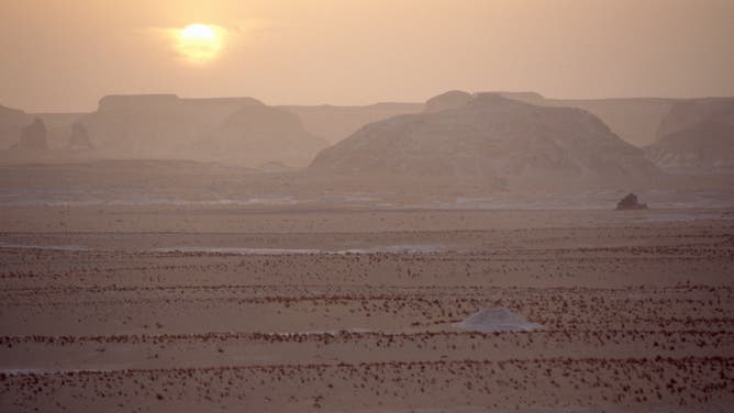 The sun shines over the Libyan desert in north Africa.