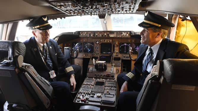 Two pilots in a cockpit.