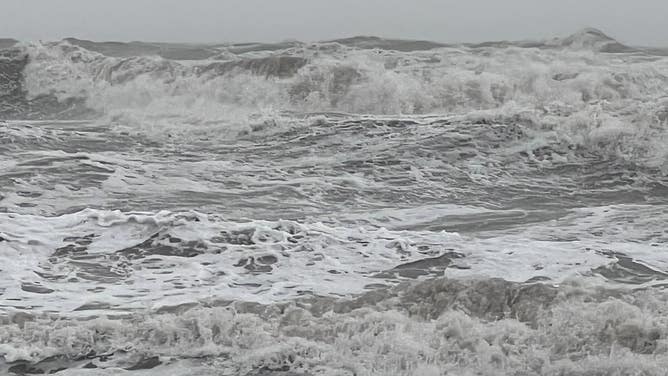Waves crash over the Daytona Beach boardwalk as Tropical Storm Nicole continues to move northwest across Florida on Nov. 10, 2022.