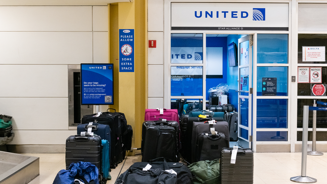 FILE - Lost bags outside of United Airlines' baggage claim at Reagan National Airport in Arlington, Virginia, U.S., on Friday, Dec. 24, 2021. Air carriers scrapped more than 800 U.S. flights for the holiday weekend, led by United Airlines and Delta Air Lines, as surging Covid infections and the prospects of bad weather disrupted Christmas travel.