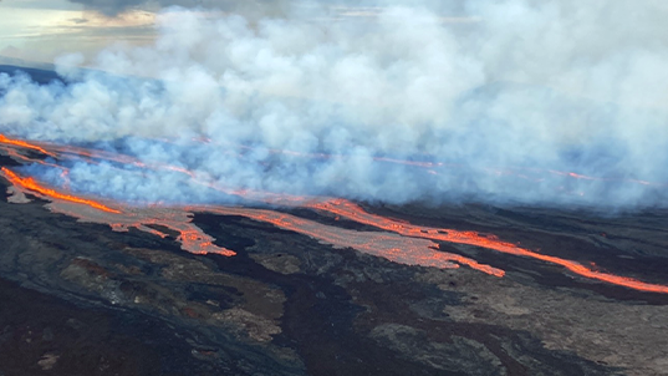 Lava is seen flowing from Hawaii's Mauna Loa volcano after it began to erupt on Sunday night.