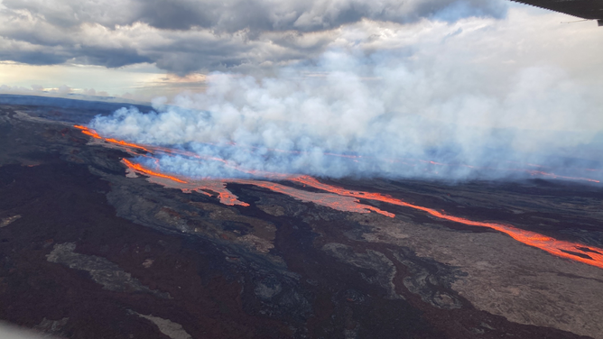Lava is seen flowing from Hawaii's Mauna Loa volcano after it began erupting on Sunday night.