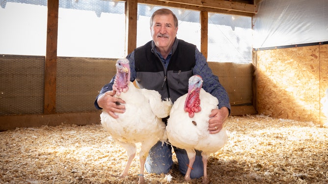 National Turkey Federation chairman Ronnie Parker with turkeys Chocolate and Chip.