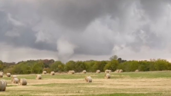 A tornado hits the ground and causes debris to fly in Miller Grove, Texas.