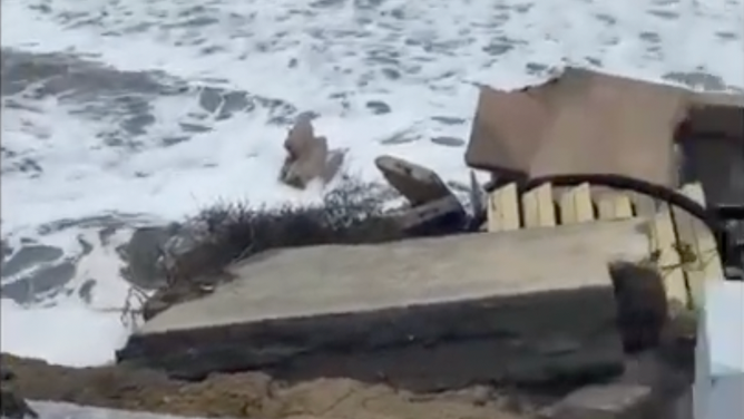 Waves washed away a stairway for a vacation home in Port Orange, Florida.