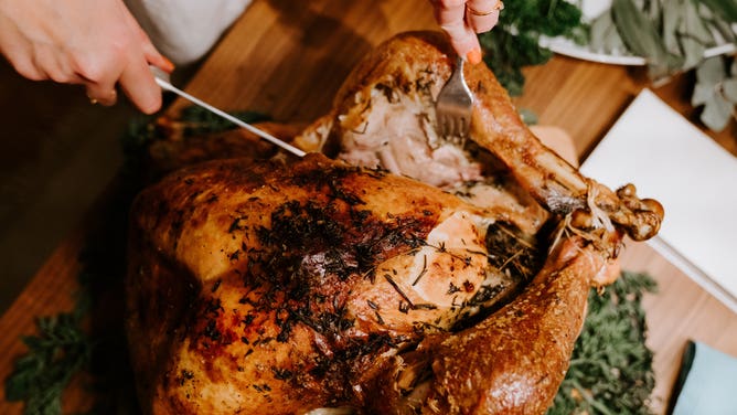 A turkey being carved.