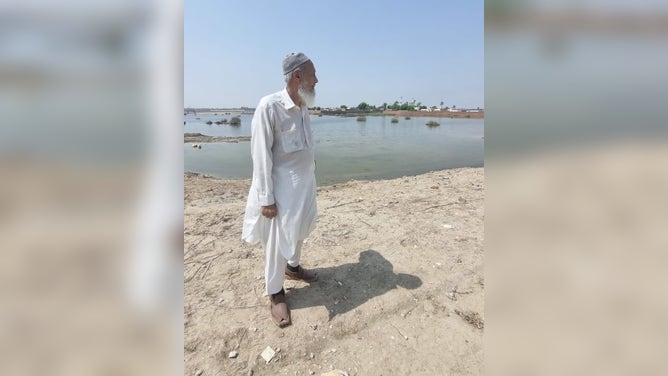 Qadri's father at his farm in Sukkur, Pakistan, after the floods began to subside.