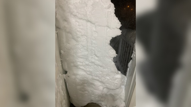 Semi trucks were buried during a blizzard in South Dakota forcing their drivers to stay at a fuel stop for days. (Image credit: TIM PLETTEN)