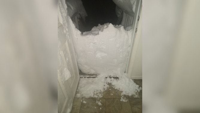 Semi trucks were buried during a blizzard in South Dakota forcing their drivers to stay at a fuel stop for days. (Image credit: TIM PLETTEN)