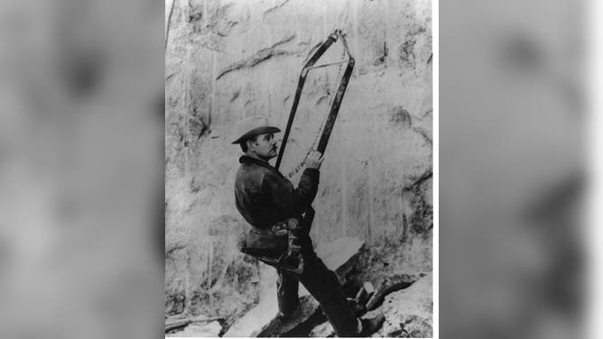 Gutzon Borglum, sculptor of Mount Rushmore, is shown here in a Bosun's chair inspecting the work on the memorial. Workers used the Bosun's chairs, suspended from above, while they drilled with jackhammers into the granite.