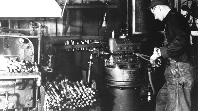 A blacksmith sharpens drill steel in a shop located at Mount Rushmore. The drill bits were used to drill into the granite. A blacksmith would sharpen as many as 400 drill bits in one day.