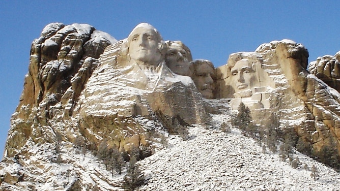 Mount Rushmore National Memorial powdered with snow.