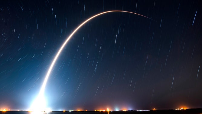 A SpaceX Falcon 9 rocket streaks across the Florida sky on Dec. 28, 2022, marking the company's 60th rocket launch of the year.