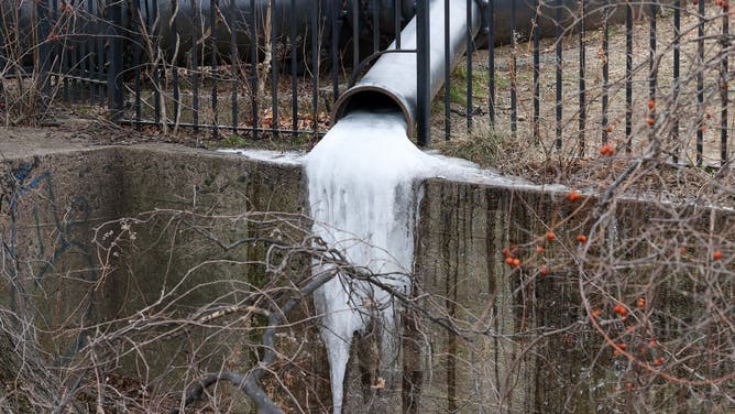 Frozen water flow is seen in a pipe at the Paterson Great Falls National Historic Park in New Jersey, United States on January 16, 2022.