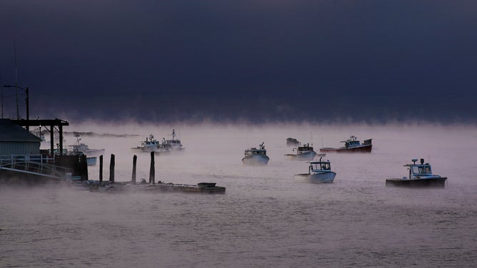 Sea smoke rises around lobster boats moored in Cape Porpoise harbor during low single digit temperatures on Thursday morning, January 27, 2020. 