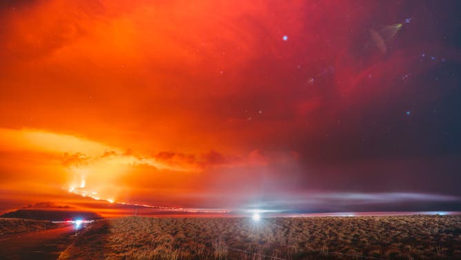 Lava fissures flow downslope from the north flank of Mauna Loa Volcano on December 5, 2022 in Hilo, Hawaii.