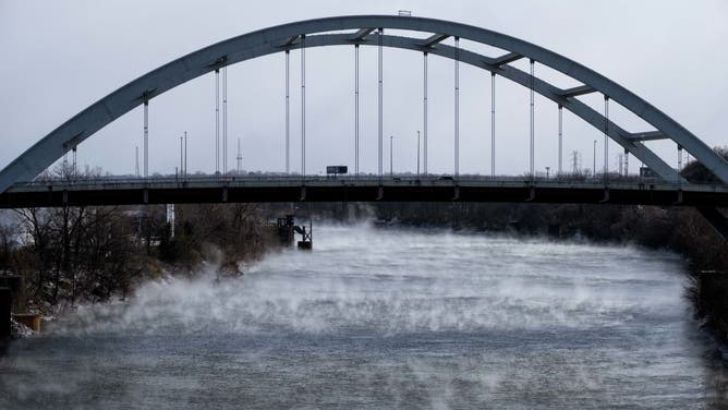 Steam rises off of the Cumberland River in Nashville, Tennessee on December 23, 2022 after winter storm Elliot moved through the Middle Tennessee region leaving behind freezing rain, snow and below freezing temperatures in Nashville, Tennessee.