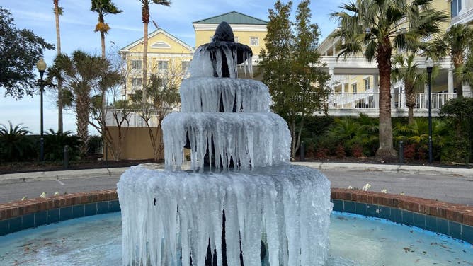Ice adorns a fountain in Charleston, South Carolina, on December 24, 2022, where temperatures are forecast to reach a high of 32F (0C). - The winter storm that pummelled the US with blinding snow and powerful Arctic winds left 1.7 million customers without power on December 24 as thousands of cancelled flights stranded travelers. 