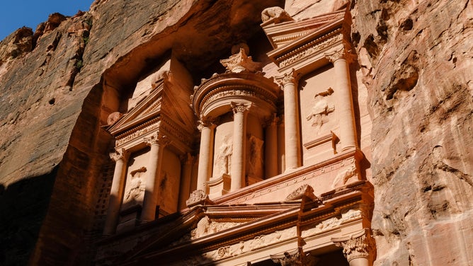 Morning sun shines on the temple Al Khazneh in Petra, Jordan.