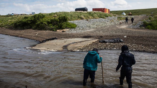 Newtok residents check out the future location of the village, which is having to be relocated to Nelson Island on July 2, 2015 near Newtok, Alaska. Newtok has a population of approximately of 375 ethnically Yupik people and was established along the shores of the Ninglick River, near where the river empties into the Bering Sea,