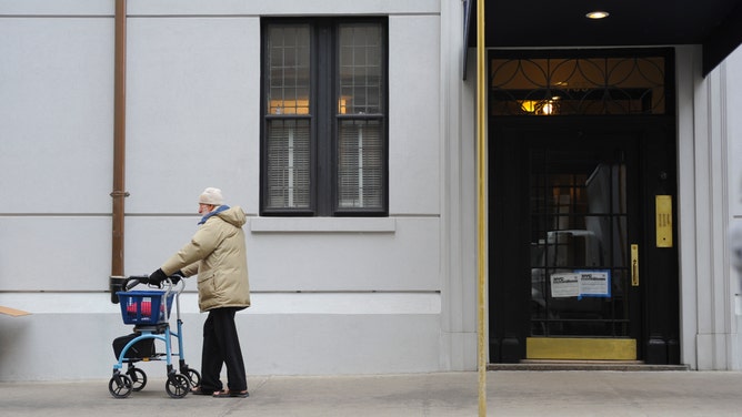 Older man taking a stroll.