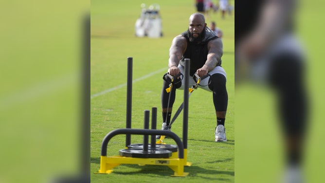 Redskins offensive lineman Morgan Moses (76)pulls a wight sled during day 4 of the Washington Redskins summer training camp in Richmond VA, August 1, 2016. 