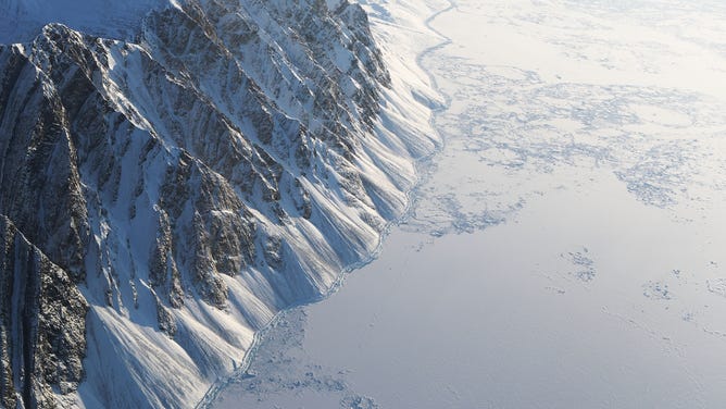 Sea ice (R) is seen from NASA's Operation IceBridge research aircraft on March 29, 2017 above Ellesmere Island, Canada.