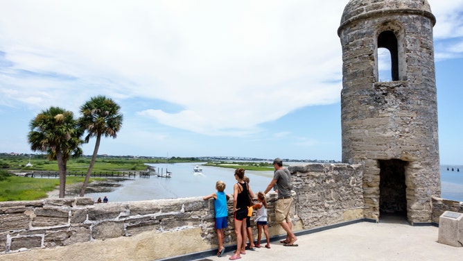 A family at the sentry post at the Castillo de San Marcos National Monument.