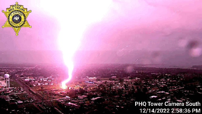 Cameras atop a communications tower at the St. John the Baptist Parish Sheriff’s Office in Louisiana were able to capture a stunning image of a bolt of lightning that struck a parking lot on Wednesday.