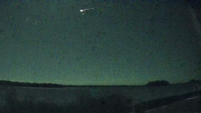 This angle shows the meteor over fields and trees in Freeport, Maine, on December 14, 2022. 