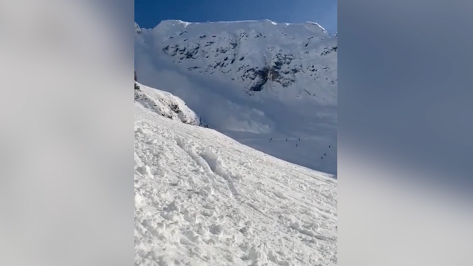 The avalanche starts careening down the mountain.