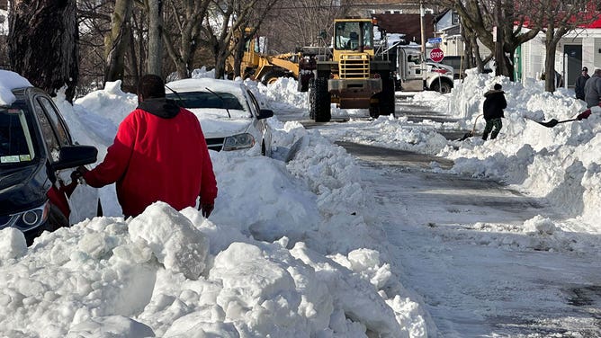 Mountains of snow': Buffalo residents say they expect to be clearing snow  for days