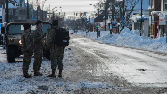 Helping the National Guard dig up buffalo after a blizzard