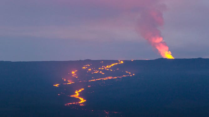 Lava and smoke are seen spewing Manua Loa in Hawaii during an eruption in December 2022.