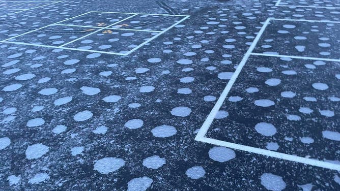 The air pockets formed circles around the painted white squares on the playground.