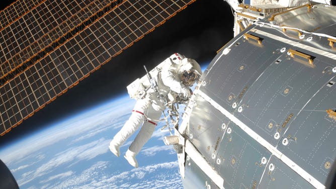 Astronaut Randy Bresnick participates in an extravehicular activity (EVA) as part of the construction and maintenance of the International Space Station. 