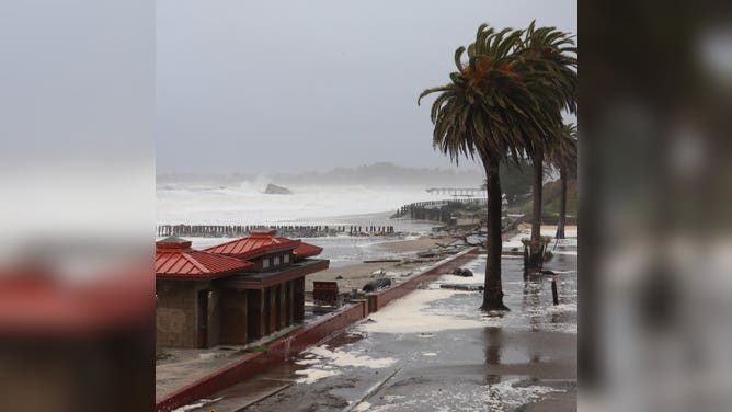 Flooding is seen in the town of Aptos in Santa Cruz County, California. A powerful bomb cyclone battered the Golden State with strong winds and heavy rain.