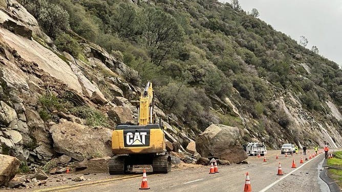 Crews work to clear a rockslide near Fresno on State Route 168.