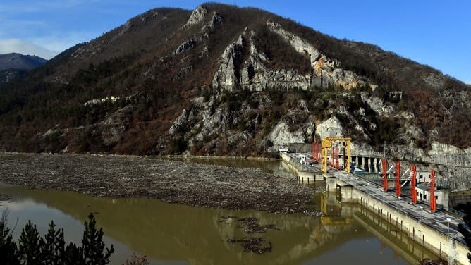 More than 5,000 cubic meters of waste and debris are seen at the dam of "Visegrad" water power plant, on river Drina, near Eastern-Bosnian town of Visegrad, on January 5, 2021.