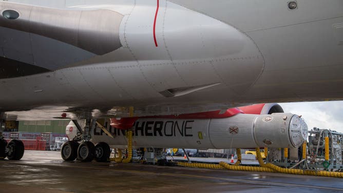 The LauncherOne rocket, operated by Virgin Orbit Holdings Inc., attached to the undercarriage of the 'Cosmic Girl' Boeing Co. 747 launch aircraft, operated by Virgin Orbit Holdings Inc., on the tarmac at Spaceport Cornwall, located at Cornwall Airport Newquay, in Newquay, UK, on Tuesday, Nov. 8, 2022.