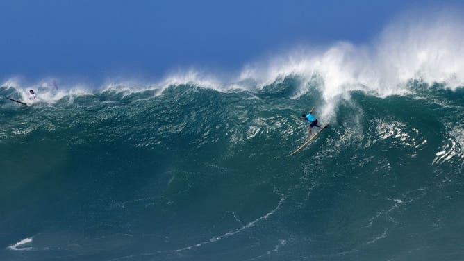 Hawaiian surfer Zeke Lau rides a wave during The Eddie Aikau Big Wave Invitational surfing contest on January 22, 2023, at Waimea Bay on the North Shore of Oahu in Hawaii.