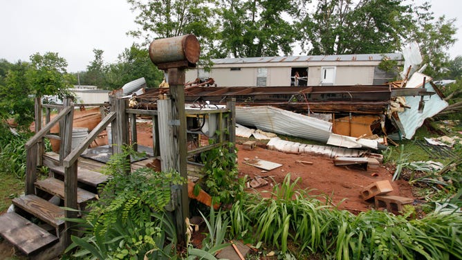 The front porch of a trailer home remained after struck by a tornado at the Prairie Creek Village trailer park May 11, 2010 in Slaughterville, Oklahoma.
